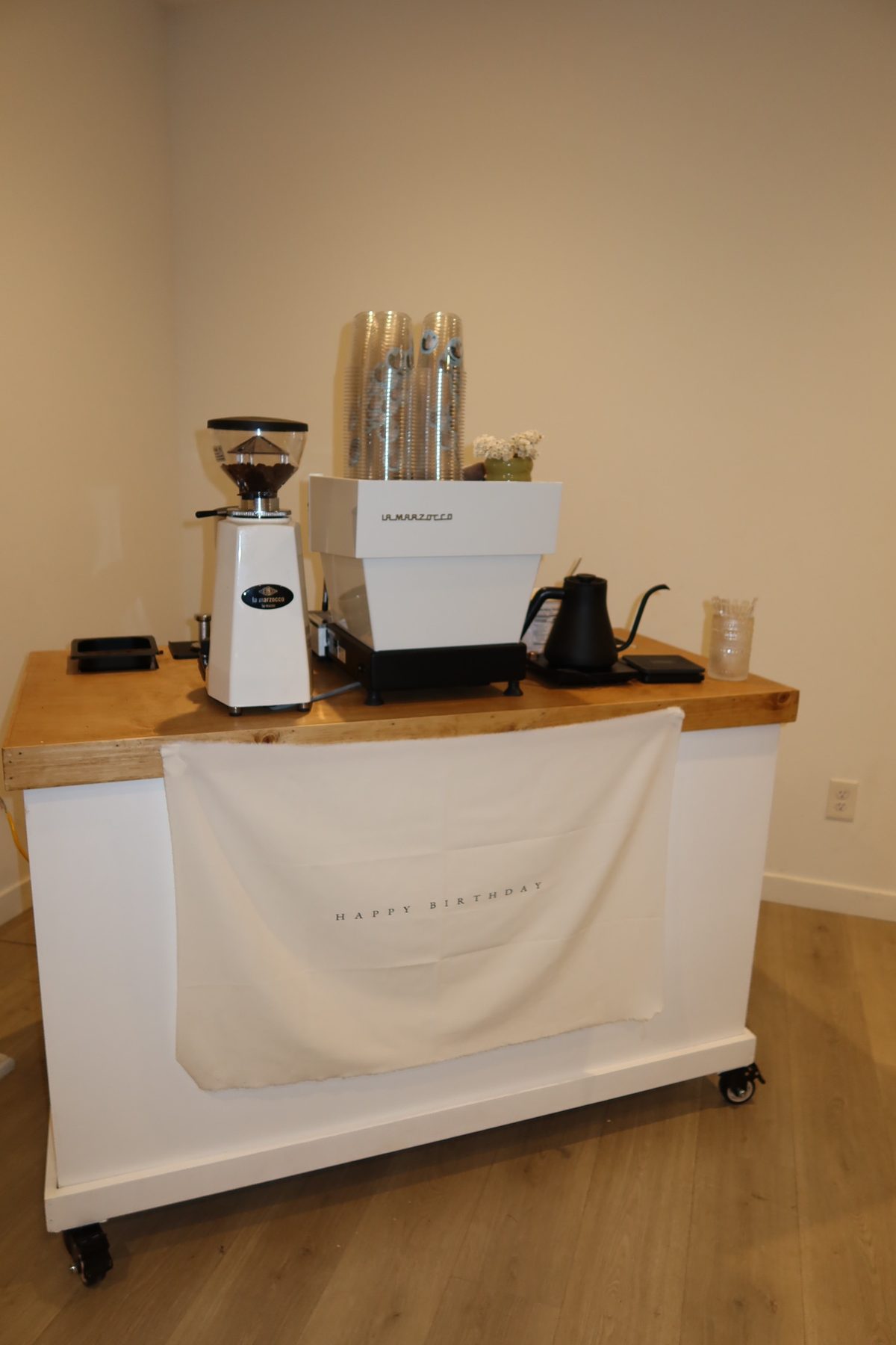 The Garden Coffee Co. mobile coffee cart with La Marzocco espresso machine, grinder, and botanical styling